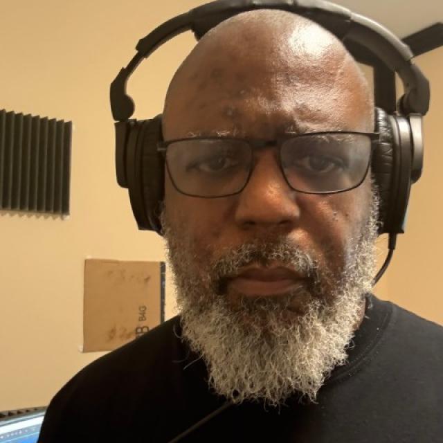 Doc E.C. working in his studio while completing his first collection of independently engineered singles.